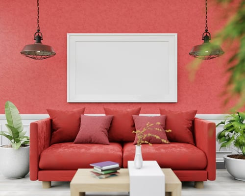 Living room with a bold red accent wall and framed art, painted by AR Interiors Decoration Inc