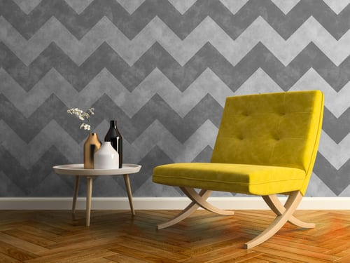 Chevron wallpaper installed on a feature wall with herringbone wood flooring by AR Interiors Decoration Inc